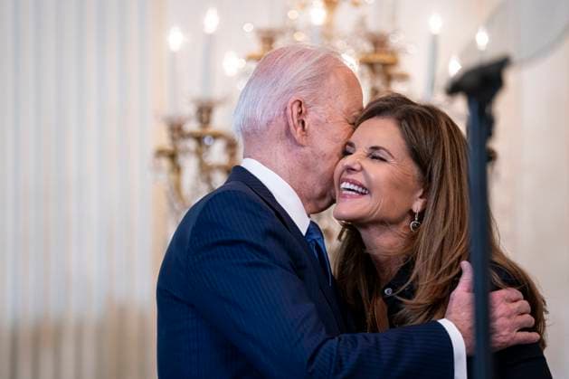 US President Joe Biden greets Maria Shriver, former First Lady of California, during a Women s History Month reception in the East Room of the White House in Washington, DC on Monday, March 18, 2024. The Biden administration is rolling out an executive order to strengthen women s health research standards across federal agencies and prioritize its funding in an effort to close the gap on long-standing disparities.  WAX20240318813 AlxDrago