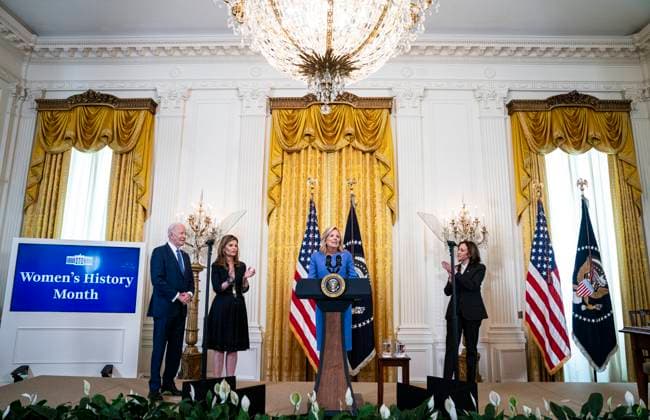 US First Lady Jill Biden speaks with US President Joe Biden and Maria Shriver, former First Lady of California, left, and US Vice President Kamala Harris, right, during a Women s History Month reception in the East Room of the White House in Washington, DC on Monday, March 18, 2024. The Biden administration is rolling out an executive order to strengthen women s health research standards across federal agencies and prioritize its funding in an effort to close the gap on long-standing disparities.  WAX20240318824 AlxDrago