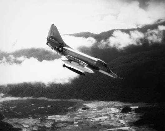 VIETNAM WAR: A4 SKYHAWK. A U.S. Navy A4 Skyhawk dropping a bomb on Viet Cong forces in South Vietnam, 1965.  Copyright: xGRANGERx xGRANGERx 0001994