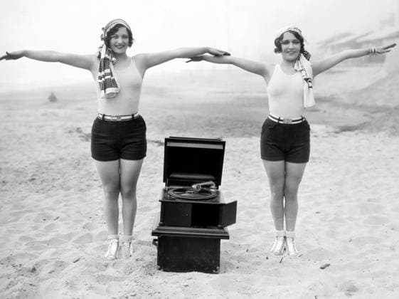 PHONOGRAPH, c1929. Joan Crawford and Dorothy Sebastian photographed c1929 with a portable phonograph in Santa Monica, California.  Copyright: xGRANGERx xGRANGERx 0006941