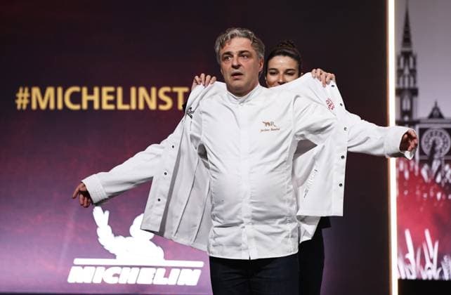 (240319) -- TOURS, March 19, 2024 -- French chef Jerome Banctel changes his new chef jacket after being awarded a third Michelin star during the Michelin Guide for France 2024 awards ceremony in Tours, France, March 18, 2024. The Michelin Guide launched its 2024 France edition on Monday in Tours. ) FRANCE-TOURS-MICHELIN GUIDE GaoxJing 