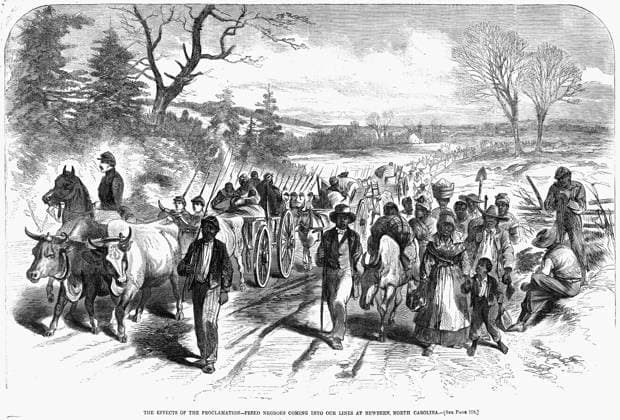 CIVIL WAR: FREEDMEN, 1863. Freed slaves coming into the Union lines at New Bern, North Carolina, following the Emancipation Proclamation. Engraving, 1863.  Copyright: xGRANGERx xGRANGERx 0015220