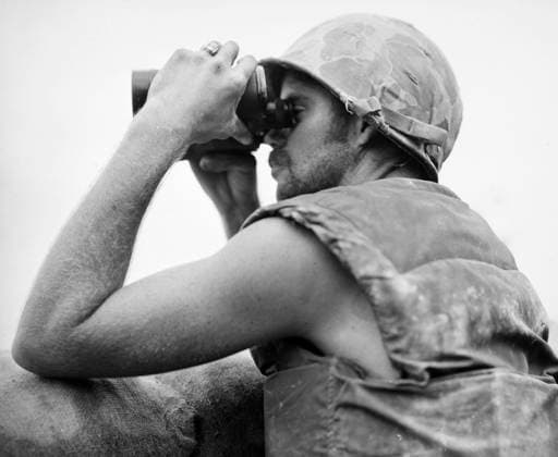 KOREAN WAR: BUNKER HILL. A Marine observes the results of artillery action during the Battle of Bunker Hill, 12-16 August 1952.  Copyright: xGRANGERx xGRANGERx 0017834