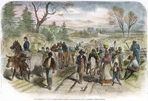 CIVIL WAR: FREEDMEN, 1863. Freed slaves coming into the Union lines at New Bern, North Carolina, following the Emancipation Proclamation. Engraving, 1863.  Copyright: xSarinxImagesx xGRANGERx 0034396
