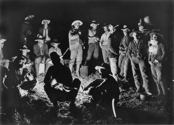 COWBOYS gathered around a campfire at Matador, Texas: photographed by Erwin Evans Smith (1886-1947).  Copyright: xGRANGERx xGRANGERx 0035578