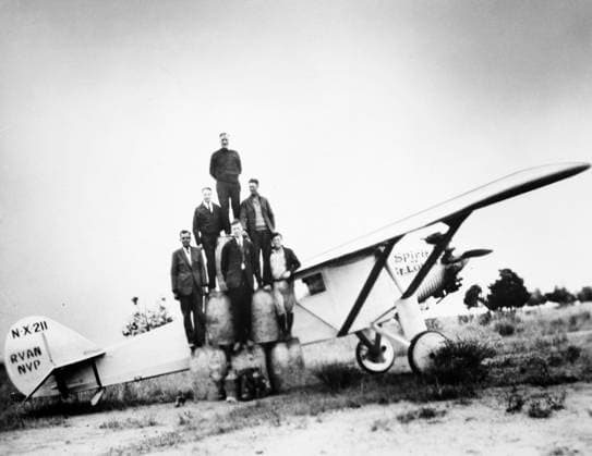 CHARLES A. LINDBERGH (1902-1974). American aviator. Lindbergh (bottom center of pyramid) and associates photographed with the Ryan monoplane, Spirit of St. Louis, 1927.  Copyright: xGRANGERx xGRANGERx 0041558