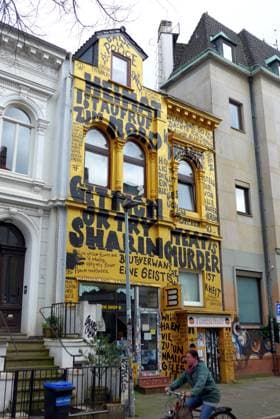 In a side street of Bremens Steintor district stands a residential and commercial building with a completely painted façade Below is the Golden Shop book and record store