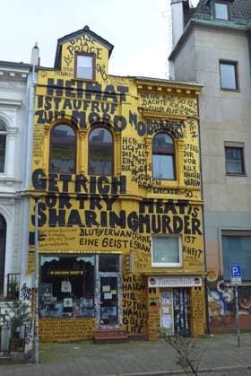 In a side street of Bremens Steintor district stands a residential and commercial building with a completely painted façade Below is the Golden Shop book and record store