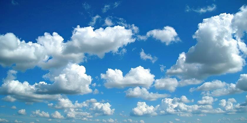 Creative Highlights World A beach with a few people walking and relaxing, under a sky filled with fluffy clouds. AI GENERATED IMAGE Colors 022 RECORD DATE NOT STATED