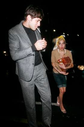 Amy Winehouse and Mark Ronson spend a night out together and both check into the same hotel Just after midnight, Amy Winehouse leaves her home with Mark Ronson. She stops off for supplies of booze, icecream and a Sun newspaper. After this they both go to a friend s studio for a party, a known drug dealer stops by with some supplies, following the party, both Amy and Mark check into the same hotel in London. London, England, Friday 12th January 2008., Credit:Ringo Avalon 0534431729