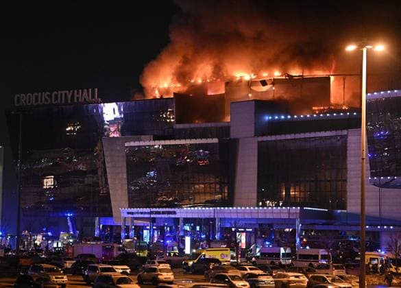 Russia Concert Shooting 8647694 22.03.2024 Smoke rises above the Crocus City Hall concert venue following a reported shooting incident, near Moscow, Russia. Several gunmen in combat fatigues burst into a concert hall on March 22 and fired automatic weapons at the crowd, injuring an unspecified number of people. Sergey Bobylev Sputnik Moscow Russia  Copyright: xSergeyxBobylevx