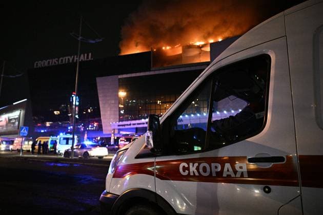 Russia Concert Shooting 8647704 22.03.2024 An ambulance vehicle is seen near the Crocus City Hall concert venue following a reported shooting incident, near Moscow, Russia. Several gunmen in combat fatigues burst into a concert hall on March 22 and fired automatic weapons at the crowd, injuring an unspecified number of people. Sergey Bobylev Sputnik Moscow region Russia  Copyright: xSergeyxBobylevx