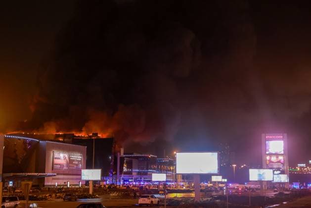 RUSSIA, MOSCOW REGION - MARCH 22, 2024: Smoke rises over the Crocus City Hall in the town of Krasnogorsk where unidentified persons opened fire. Evacuation is underway. Vladimir Gerdo TASS  68457040