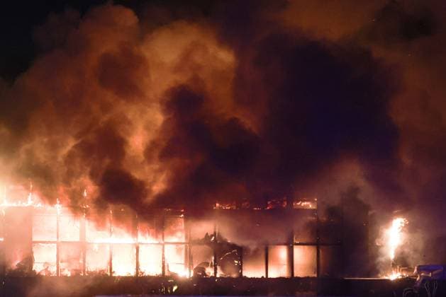 RUSSIA, MOSCOW REGION - MARCH 22, 2024: Smoke rises above the Crocus City Hall in the town of Krasnogorsk where unidentified persons opened fire. Evacuation is underway. Vladimir Gerdo TASS  68458779