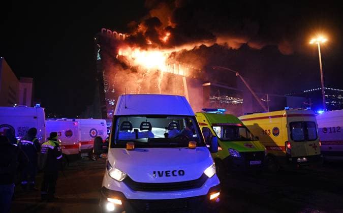 Russia Terrorist Attack 8647861 22.03.2024 Ambulances are seen near the burning Crocus City Hall concert venue following a reported shooting incident, near Moscow, Russia. The Russian Federal Security Service (FSB) said that there are people dead and injured as a result of the terrorist attack in the concert hall in Moscow region. A massive fire has also broken out at the venue. Sergey Bobylev Sputnik Moscow region Russia  Copyright: xSergeyxBobylevx