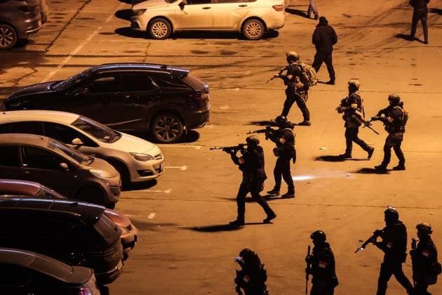 March 22, 2024. Russia, Moscow Region, Krasnogorsk. Special police unit officers are seen outside the Crocus City Hall in the town of Krasnogorsk after a mass shooting by several unidentified gunmen. Evacuation is underway. DmitryxGolubovich