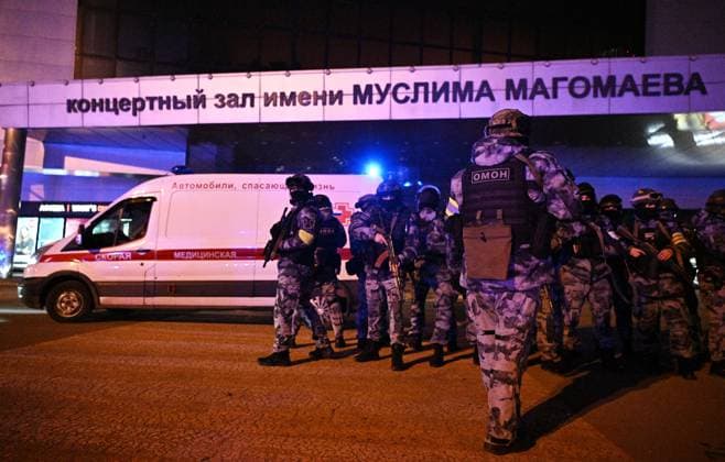 Russia Terrorist Attack 8648036 22.03.2024 Law enforcement officers are seen near the Crocus City Hall concert venue following a reported shooting incident, near Moscow, Russia. The Russian Federal Security Service (FSB) said that there are people dead and injured as a result of the terrorist attack in the concert hall in Moscow region. A massive fire has also broken out at the venue. Sergey Bobylev Sputnik Moscow region Russia  Copyright: xSergeyxBobylevx