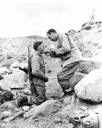 WORLD WAR II: IWO JIMA. A United States Marine receiving Communion on Iwo Jima, 1945.  Copyright: xGRANGERx xGRANGERx 0079104