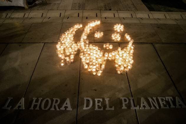 March 23, 2024, Malaga, Spain: A mosaic made with candles that depicts a panda, the symbol of WWF, is seen on the ground with slogan: La hora del planeta (The hour of the earth) during the Earth Hour in the centre of Malaga. The figure made with candles is a panda, the symbol of the WWF. Thousands of cities worldwide switched off their electric lights during Earth Hour to highlight the dangers of climate change. Malaga Spain - ZUMAs197 20240323_aaa_s197_868 Copyright: xJesusxMeridax