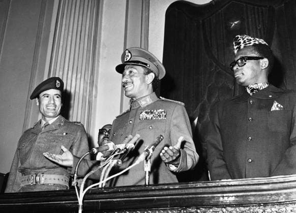 SADAT, GADDAFI, & MOBUTU. From left: Libyan leader Muammar Gaddafi, Egyptian President Anwar Sadat, and President of Zaire Mobutu Sese Seko. Photographed c1971.  Copyright: xGRANGERx xGRANGERx 0108801