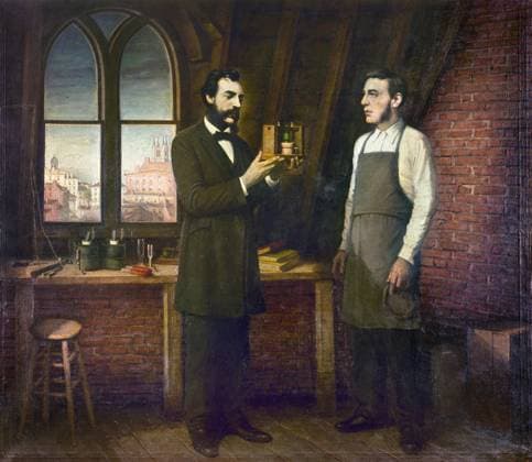 ALEXANDER GRAHAM BELL (1847-1922). American (Scottish-born) teacher and inventor. Bell in his laboratory with his assistant, Thomas Augustus Watson, holding an early model of the telephone. Oil painting, undated.  Copyright: xGRANGERx xGRANGERx 0116087