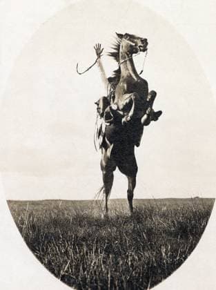 ERWIN E. SMITH (1886-1947). American cowboy photographer. Photographed riding a bucking bronco on the open range of Texas on 14 December 1908.  Copyright: xGRANGERx xGRANGERx 0124952