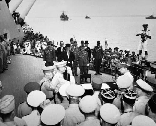 SURRENDER OF JAPAN, 1945. General Douglas MacArthur (at table, right) is saluted at the singing of the surrender of Japan on board the U.S.S. Missouri in Tokyo Bay, 2 September 1945.  Copyright: xGRANGERx xGRANGERx 0167055