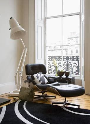 Oversize anglepoise floor lamp behind Eames lounge chair and ottoman in front of window Oversize anglepoise floor lamp behind Eames lounge chair and ottoman in front of window, Credit:Douglas Gibb Avalon 0538058472