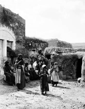 Palestine: A Palestinian peasant farmer family outside their home in Kafr Kanna, Galilee, c. 1910 Kafr Kanna (Arabic: ÙƒÙØ± ÙƒÙÜØßŽ, kafr kanÄ; Hebrew: ×›Ö·Ö¼×¤Ö°×¨ ×›Ö·Ö¼× Ö¸Ö¼×ŽŽ) is an Arab town in the Galilee region of Israel that is associated with the New Testament village of Cana, where Jesus turned water into wine.<br ><br > Palestine (Arabic: ÙÙ Ø³Ø·ÙäÙÜŽ Filasá¹­Ä«n, Falasá¹­Ä«n, Filisá¹­Ä«n; Greek: Î Î±Î»Î±Î¹ÏƒÏ Î¯Î½Î·, PalaistinÄ ; Latin: Palaestina; Hebrew: ×¤×œ× ×ª×™× × Palestina) is a n ame given to the geographic region between the Mediterranean Sea and the Jordan River. The region is also known as the Land of Israel (Hebrew: ××¨×¥Ö¾×™× ×¨××œ Eretz-Yisra el), the Holy Land and the Southern Levant.<br ><br > Copyright: xxPicturesxFromxHistoryx