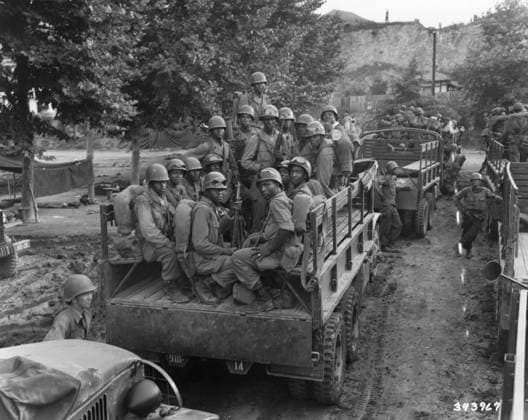 KOREAN WAR, 1950. Soldiers of the 25th Infantry Division moving up to the firing line in Korea. Photograph, July 1950.  Copyright: xGRANGERx xGRANGERx 0260043