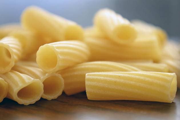Close-up of uncooked rigatoni pasta on wood surface Fort Wayne, Indiana, United States R_GCNK240325-1374773-01 ,property released