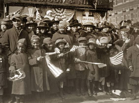 WWI: PARADE, 1919. A crowd gathered on Fifth Avenue for the victory parade of the 369th Infantry Regiment in New York City. Photograph, February 1919.  Copyright: xGRANGERx xGRANGERx 0528304