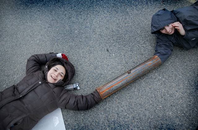 News Themen der Woche KW13 March 26, 2024, Sandwich, Kent, United Kingdom: Activists from Palestine Action attach themselves to a metal lock-on and use their bodies to block the main vehicular access road into Instro Precision during the demonstration. Instro Precision provide components for Elbit Systemis weaponry. Palestine Action continues to target subsidiary companies of Israeli arms company Elbit Systems in an attempt to isolate them and make business impossible. This tactic has caused two of Elbit™s ten main businesses to close in the UK and several partner companies to cut ties with them. Sandwich United Kingdom - ZUMAs197 20240326_aaa_s197_464 Copyright: xMartinxPopex
