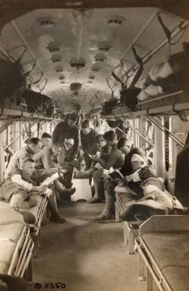 WWI: HOSPITAL TRAIN, 1918. Major Robert Hardaway examining injured soldiers aboard the the American hospital train 54 in Herreville, France. Photograph, 26 April 1918.  Copyright: xGRANGERx xGRANGERx 0528977
