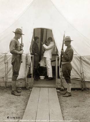 FLU PANDEMIC, 1918. American troops receiving a throat spray to prevent influenza at Love Field in Dallas, Texas. Photograph, December 1918  Copyright: xGRANGERx xGRANGERx 0529211
