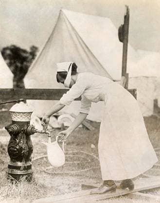FLU PANDEMIC, 1918. A nurse at the hospital camp on the grounds of the Corey Hill Hospital in Brookline, Massachusetts, during the influenza pandemic. Photograph, September 1918.  Copyright: xGRANGERx xGRANGERx 0529236