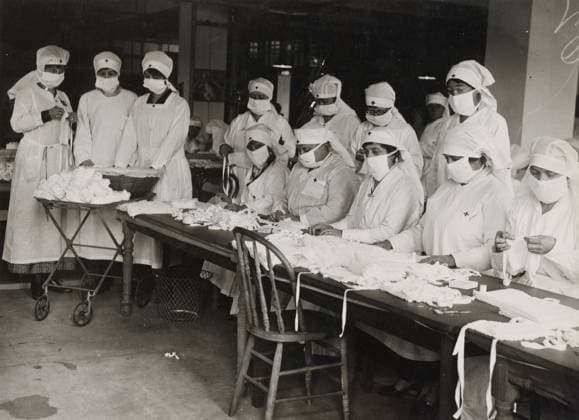 FLU PANDEMIC, 1918. Red Cross workers in Boston, Massachusetts, preparing masks for American soldiers during the influenza pandemic. Photograph, 1918.  Copyright: xGRANGERx xGRANGERx 0529252