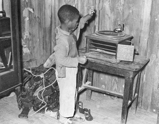 LOUISIANA: CHILD, 1939. African American child at a phonograph in Transylvania Project, Louisiana. Photograph by Russell Lee, January 1939.  Copyright: xGRANGERx xGRANGERx 0621112