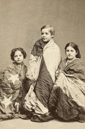 SLAVE CHILDREN, c1864. Rosina Downs, Charles Taylor, and Rebecca Huger, slaves freed in New Orleans, Louisiana. Photograph by Charles Paxton, c1864.  Copyright: xGRANGERx xGRANGERx 0636793