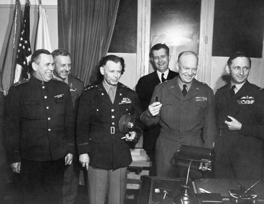 SURRENDER OF GERMANY, 1945. Allied delegates celebrating at Rheims, France after the surrender of Germany. Left to right: Soviet General Ivan Susloparov, U.S. Lieutenant General Walter B. Smith, General Dwight D. Eisenhower, Royal Air Force Chief Marshal Sir Arthur Tedder. Behind the Soviet General is General Sir William Morgan. Photograph, 1 May 1945.  Copyright: xGRANGERx xGRANGERx 0644771