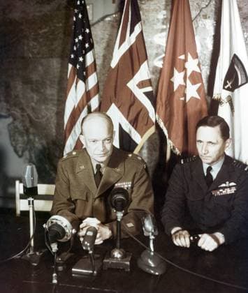 SURRENDER OF GERMANY, 1945. U.S. Army General Dwight D. Eisenhower (left) and British Air Chief Marshal Sir Arthur Tedder, addressing the world via motion picture and sound recordings after the surrender of Germany at Rheims, France. Photograph, 7 May 1945.  Copyright: xGRANGERx xGRANGERx 0644772
