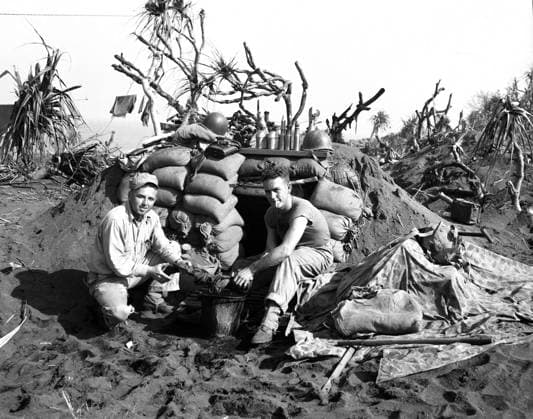WWII: IWO JIMA, 1945. A pair of Marines washing clothing during the American campaign on Iwo Jima. Photograph from the United States Marine Corps, February 1945.  Copyright: xGRANGERx xGRANGERx 0644842