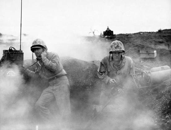 WWII: IWO JIMA, 1945. Marine flamethrower operator and radio operator in a foxhole during the Battle of Iwo Jima. Photograph from the United States Marine Corps, February 1945.  Copyright: xGRANGERx xGRANGERx 0644902
