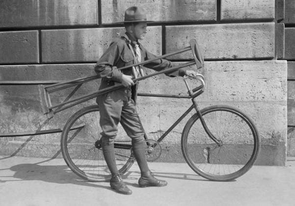 WWI: BOY SCOUT, 1918. An American Red Cross Boy Scout preparing to deliver a pair of crutches to a wounded soldier in Paris, France. Photograph, 1918.  Copyright: xGRANGERx xGRANGERx 0646162