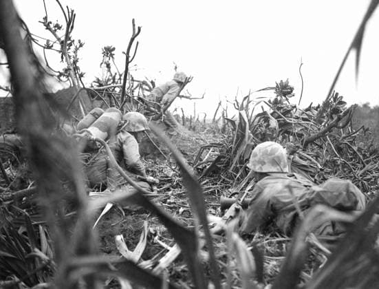 WWII: IWO JIMA, 1945. United States marines advancing through foliage during the Battle of Iwo Jima. Photograph by Karl Thayer Soule, February 1945.  Copyright: xGRANGERx xGRANGERx 0651638