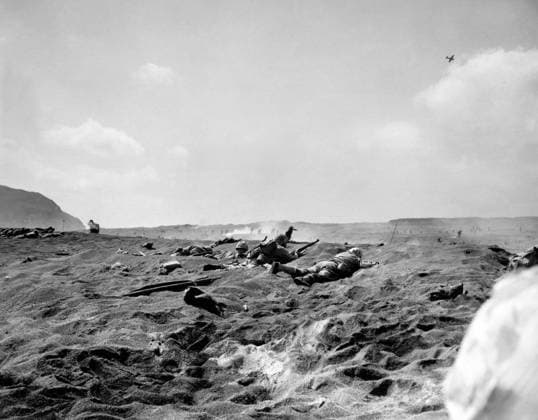 WWII: IWO JIMA, 1945. Men of the Fourth Marine Division wait to advance further onto Iwo Jima during the American invasion of the island. Photograph by Karl Thayer Soule, 19 February 1945.  Copyright: xGRANGERx xGRANGERx 0651639
