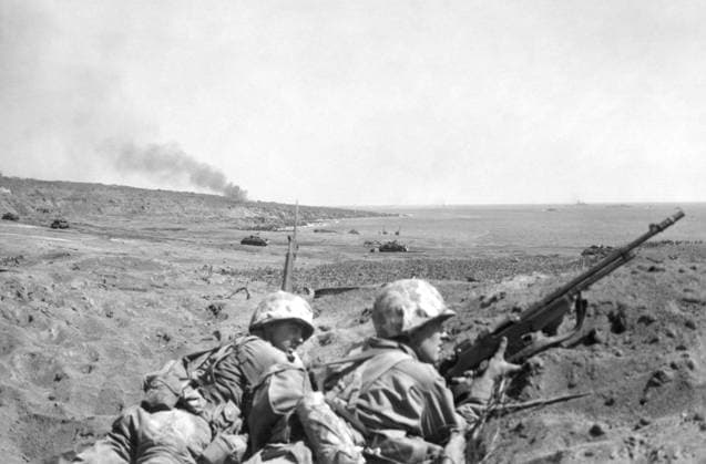 WWII: IWO JIMA, 1945. United States marines Joseph de Blanc and Frank Hall in a blast crater overlooking an American beachhead during the Battle of Iwo Jima. Photograph by Karl Thayer Soule, February 1945.  Copyright: xGRANGERx xGRANGERx 0651642