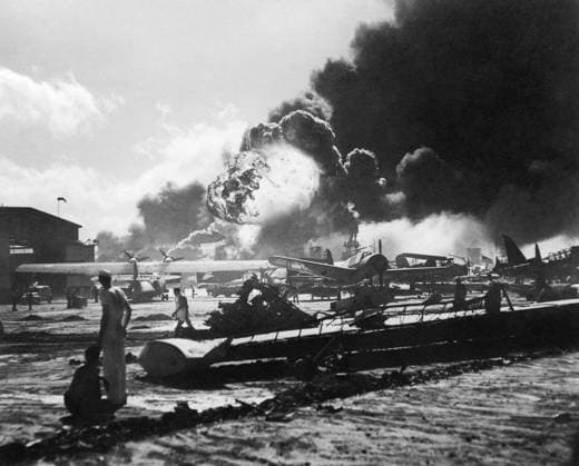 WWII: PEARL HARBOR, 1941. Ford Island Naval Air Station in the wake of the the Japanese attack on Pearl Harbor, Hawaii; in the distance, an explosion rocks the destroyer USS Shaw. Photograph, 7 December 1941.  Copyright: xGRANGERx xGRANGERx 0652410