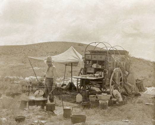 CHUCK WAGON, 1908. Cowboy cooking dinner with a chuck wagon at a camp in Texas. Photograph by Erwin E. Smith, c1908.  Copyright: xGRANGERx xGRANGERx 1031616