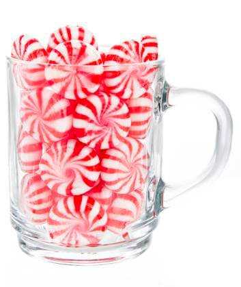 cup of candy hard red and white candy mints in a transparent cup Copyright: xZoonar.com YannxPoirierx 4208468